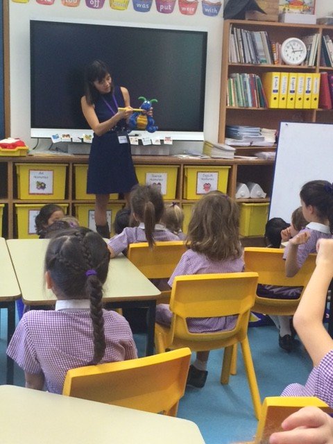 Dr Moira Wong visiting a school and talking to kids about dental hygiene